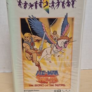 He-Man & She-Ra The Secret of the Sword VHS Cover — Colorful Illustration